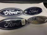 Nice!! Preowned 97AB8K141AA 3/4'' 2000-04 Focus Blue Oval Grille Emblem W/pins. Fixed Price $13.86.