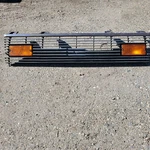 1980 1981 1982 Datsun 210 Sedan Grille W/ Turn Signal Lights. Used Ad# 9502. Fixed Price $169.00.