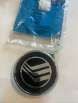 New Nos 1985-87 Mercury Lynx Grille Ornament Emblem Medallion Ford E6YY8213A. Fixed Price $15.00.