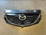 13-15 Mazda CX-9 CX9 Oem Dolphin Gray Grey Pearl Front Upper Emblem. Fixed Price $239.99.
