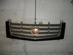 2002-2006 Cadillac Escalade Front Grille Oem (color) Sable Black W/ Gold Emblem. Fixed Price $270.00.