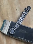1970S Nos Oldsmobile Grille Emblem Name Plate Badge Gm Part Number 556872. Fixed Price $89.99.
