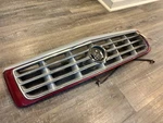 1995-2002 Cadillac Eldorado Etc Esc Maroon Grill With Support Bars. Fixed Price $85.00.