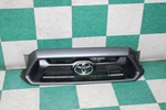 12-15 Tacoma Magnetic Gray Metallic Front Grille Upper Surround Emblem Oem. Fixed Price $389.99.