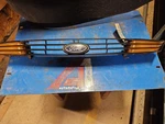 00-04 Ford Focus Grille W/turning Signals (lower Cvr Mounted) Fog Lamps Oem. Fixed Price $54.61.