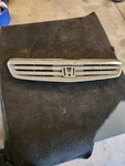 1999-2000 Honda Civic Front Center Grille Assembly Chrome Cracked. Fixed Price $60.00.
