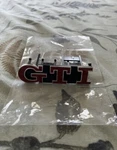Volkswagen Golf Gti MK4 Anniversary Front Badge Emblem Red Genuine 1J6853679H. Fixed Price $201.84.