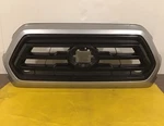 2018-2022 Toyota Tacoma Front Bumper Grille Silver And Black 53101-04070-B0 Oem. Fixed Price $295.00.