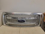 2009-2014 Ford F-150 Radiator Top Grille Molding Chrome W/ Emblem Oem. Fixed Price $227.50.
