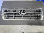 1996-1997 FZJ80 Lexus LX450 Chrome Factory + Emblem Grille With Crack. Fixed Price $60.00.