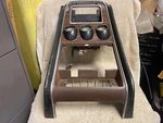 Ford D1ZB-6504302-AWA 1971-1973 Mustang Center Dash Panel Bezel Black Woodgrain. Fixed Price $425.00.