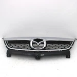 2010-2012 Mazda CX-9 Front Upper Grille W/ Emblem Oem Z8563 Dg. Fixed Price $299.95.