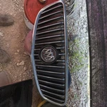 10-13 Lacrosse Front Chrome Charcoal Background Upper Center Grille Oem. Fixed Price $75.00.