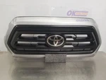 20 Toyota Tacoma SR5 Upper Grille Silver 1D6 With Chrome Surround And Radar. Fixed Price $600.00.