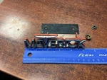 D1DB-8C052-AWA 1971 1972 1973 Ford Maverick Front Grille Ornament Emblem Grabber. Fixed Price $64.00.