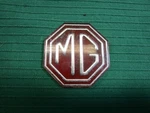Mgb, Midget- Front (mg) Grille Badge- Original. Fixed Price $10.00.