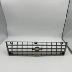 1984-1987 Chevrolet Cavalier Front Bumper Grille Argent With Chrome. Fixed Price $60.00.